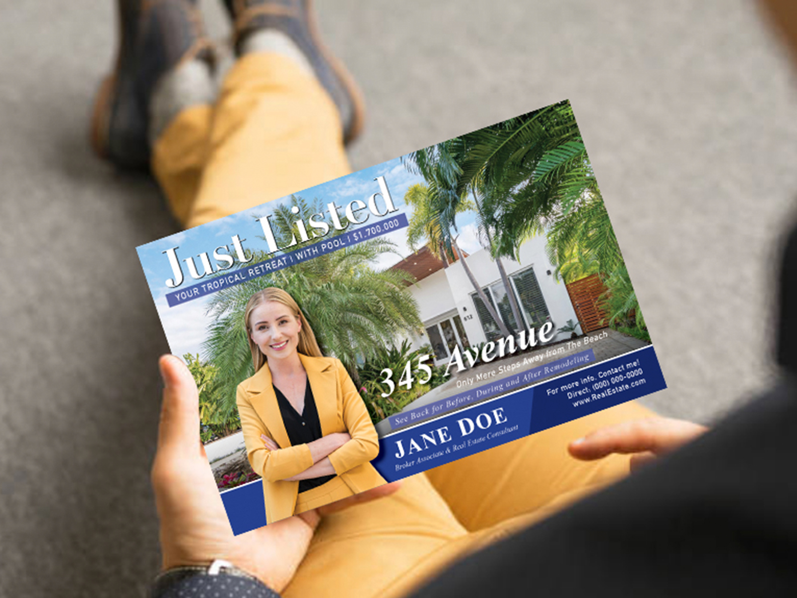 man in a suit holding a leader in print business card